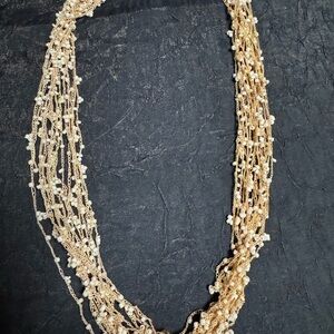 Elegant Gold and Cream Multi-Strand Necklace
